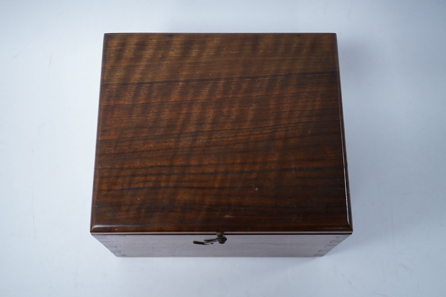 A turned wooden chess set in ebony and boxwood, king 10.5cm high, in a hardwood box. Condition - good.